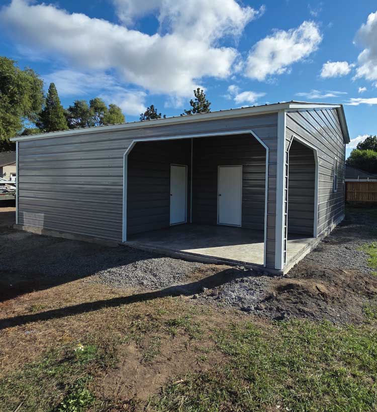 Large-scale delivery from a certified concrete supplier ensuring the perfect mix and volume for an industrial metal barn installation site.