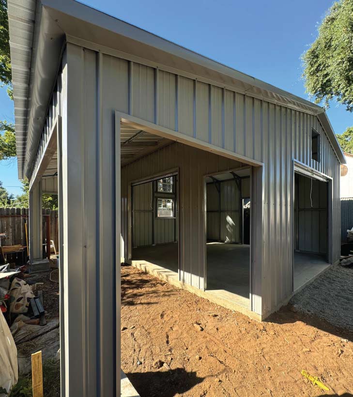 Time-lapse perspective of a large 50x100 industrial metal garage installation, showing the rapid assembly of the steel frame structure.