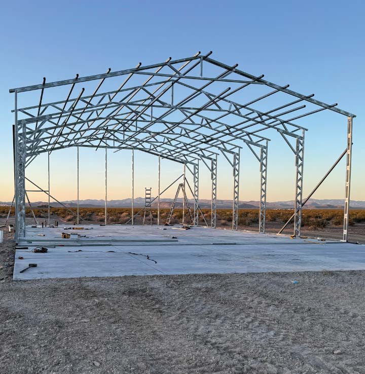 High-quality rebar-reinforced slab base prepared by the concrete supplier as the essential groundwork for a residential metal RV cover.